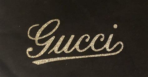 gucci cursive logo.